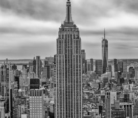 The Empire State Building with One World Trade Center behind it.