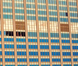 Window workers replacing a window high up on the building near the Pier 11/Wall St. Ferry dock.